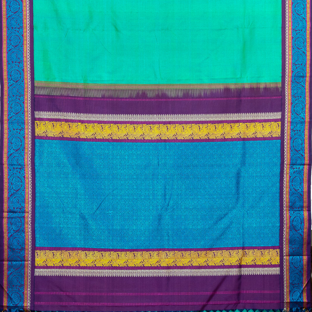 SEA GREEN SAREE WITH PURPLE KORVAI BORDER- AN UTPPALAKSHI HANDWOVEN KANCHIPURAM SILK SAREE
